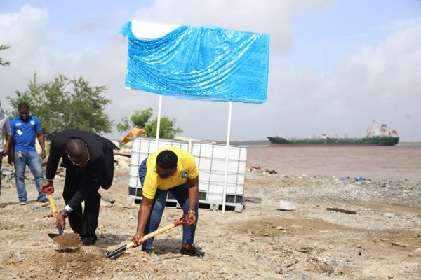 Minister of Public Infrastructure, David Patterson and Director-General of the Maritime Administration Department, Claudette Rogers turning the sod at the new site for MARAD in Kingston. (DPI photo)
