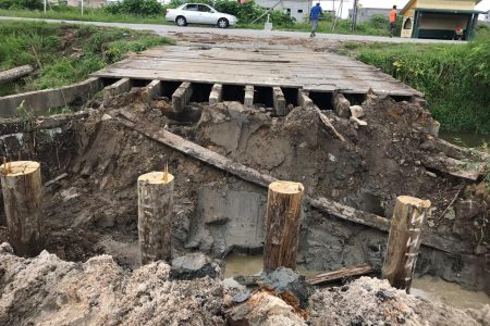  The Ministry of Public Infrastructure has commenced reconstruction of a bridge at Mocha/Arcadia, East Bank Demerara. The previous wooden structure bridge is being replaced by a concrete bridge. During a community outreach in November of 2017, then Junior Minister of Public Infrastructure Annette Ferguson had promised the residents to replace the wooden bridge. Residents had highlighted that the bridge was deteriorating.  Stabroek News understands that the bridge was closed off from public use by the Neighbourhood Democratic Council a few weeks ago due to its deteriorating state. (David Papannah photo)