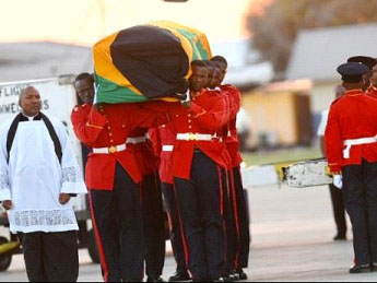 The Guard of Honour removing the body of the late Edward Seaga from the Caribbean Airlines plane to the hearse at the Norman Manley International Airport in Kingston.
