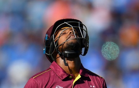 Nicholas Pooran walks off in disappointment after being dismissed against India at Old Trafford on Thursday.