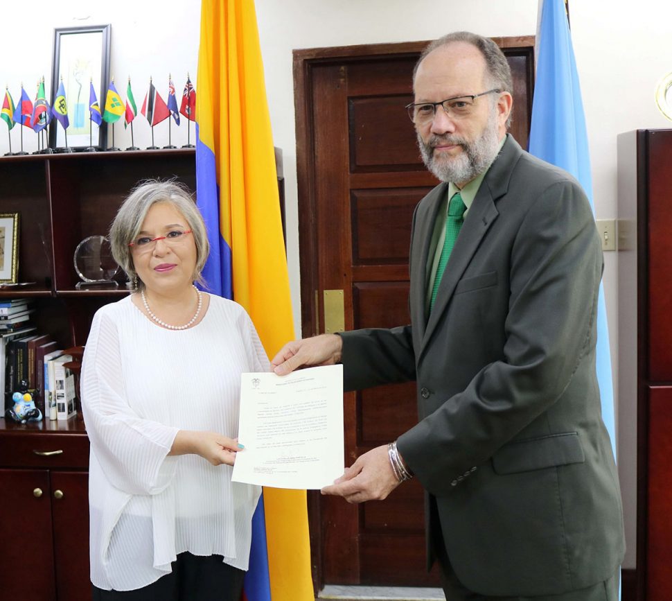 Colombian Ambassador, Martha Pinilla (left) presenting her credentials to Secretary-General, Irwin LaRocque.