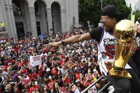 Kyle Lowry holds the Larry O’Brien Trophy during the Toronto Raptors parade yesterday.
