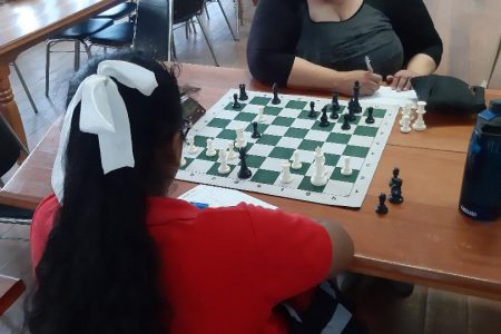 Woman FIDE Master, Maria Varona-Thomas battles Angel Rahim during her successful title defence.
