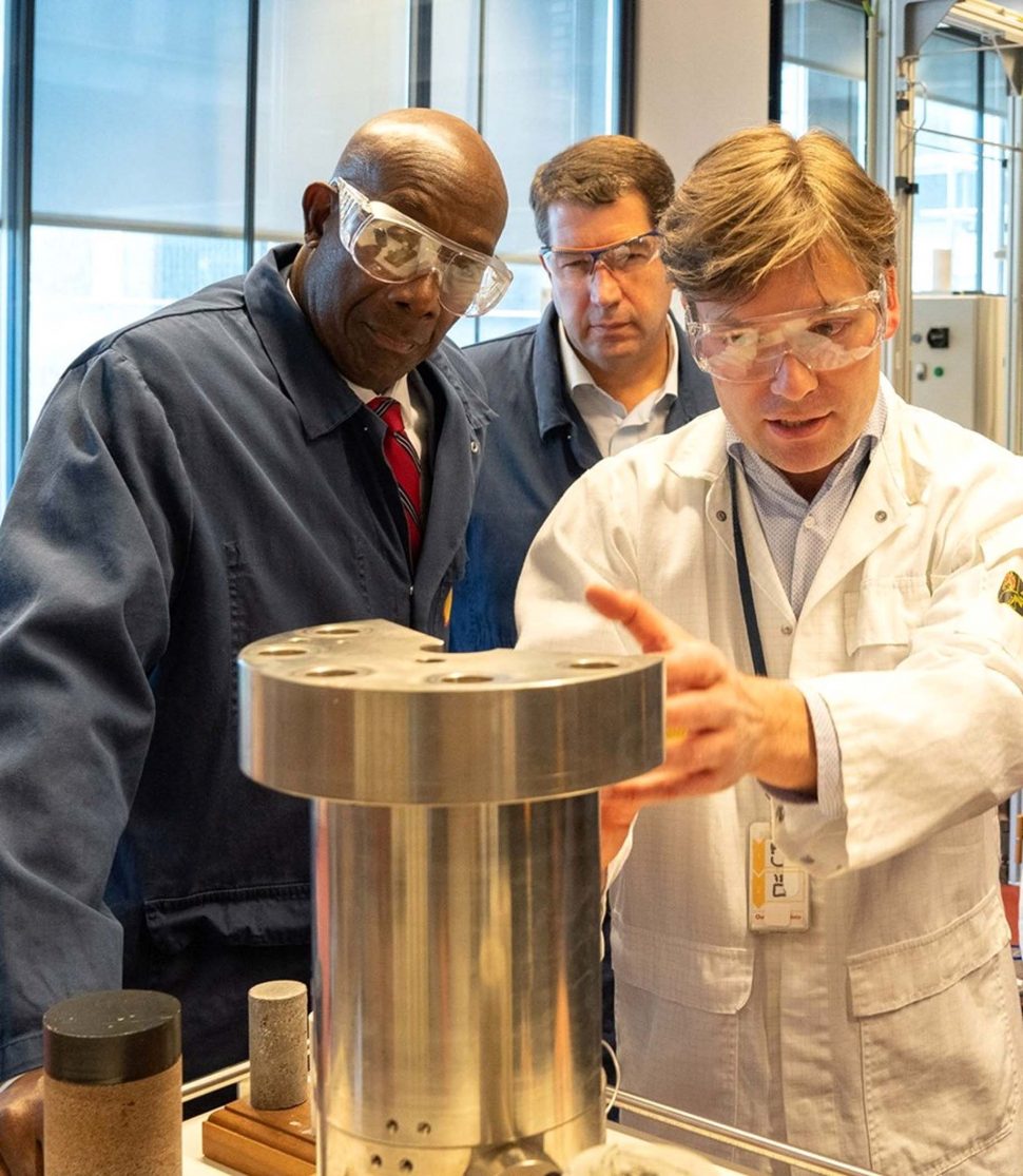 Prime Minister Dr Keith Rowley and De La Rey Venter, Executive Vice President of Shell’s Integrated Gas Venture business, watch attentively as a Shell representative displays a piece of equipment in the lab during the Prime Minister’s visit Shell Technology Centre in Amsterdam, last month.