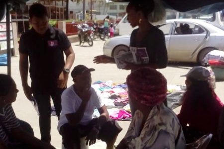 Businessman Randy Shephard and a team  gathered in front the Spready’s Supermarket in Berbice, where they interacted with residents.