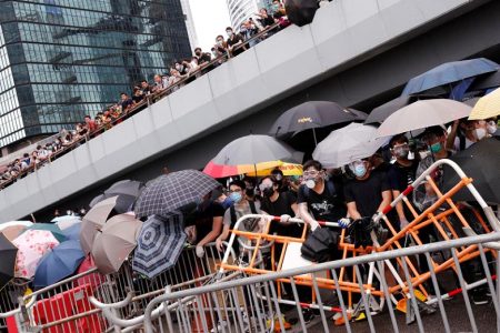 Thousands of protesters paralyse Hong Kong’s financial hub over extradition bill - Reuters
