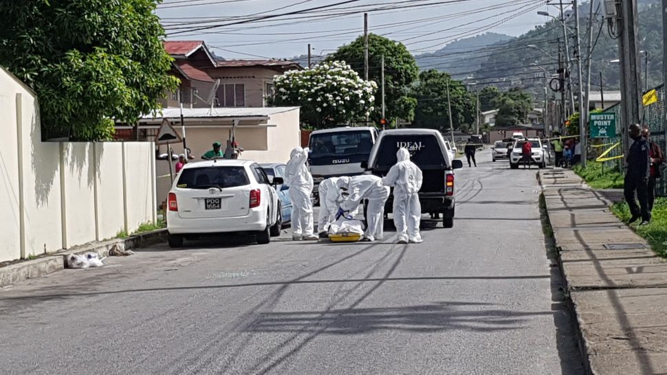 Undertakers remove Shiraz Ali’s body from his Mazda station wagon, after crime scene investigators processed the scene at Boundary Road Extension on Friday morning.