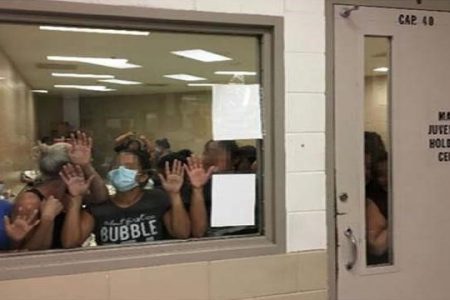Some of a group of 51 adult females press against the window of a cell built to hold 40 male juveniles at Fort Brown Border Patrol station in a still image from video in Brownsville, Texas, U.S. on June 12, 2019 and released as part of a report by the Department of Homeland Security’s Office of Inspector General on July 2, 2019. Picture pixelated at source. Office of Inspector General/DHS/Handout via REUTERS.
