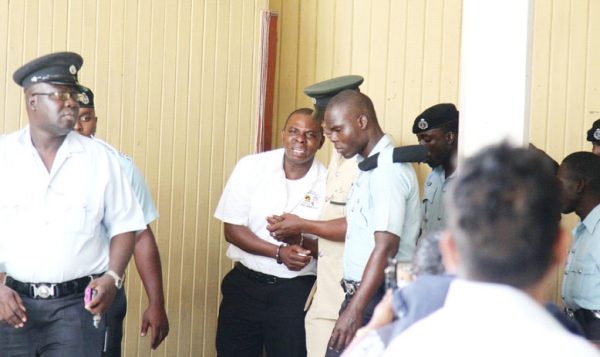 A crying Andre Hetsberger surrounded by police officers following his conviction and sentencing back in 2016