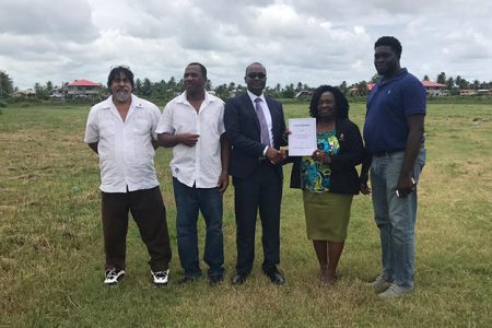 NA Mayor Winifred Heywood and GFF President Wayne Forde displaying the signed agreement for the 30-year lease at the Vryman’s Erven ground, which will serve as the site for the region’s first football facility.
