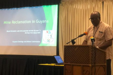 Commissioner of the Guyana Geology and Mines Commission Newell Dennison making his presentation at the event yesterday
