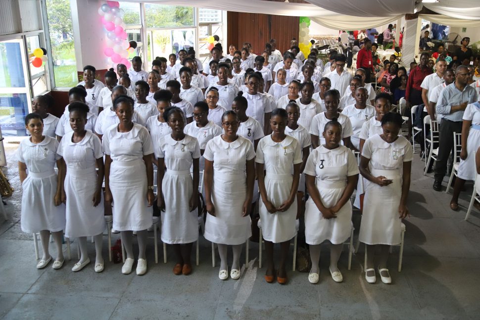 Some of the nurses who are enrolled at the Georgetown School of Nursing Annex II, reciting the Nightingale Pledge after the school was officially declared open. (Terrence Thompson photo)