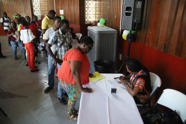 Some interested persons signing up to be part of the credit union. (Terrence Thompson photo)