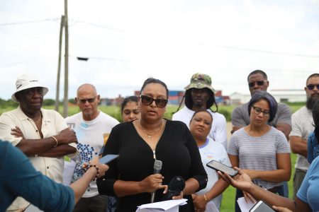 Candida Williams (centre) voicing her concerns about the proposed chemical warehouse. She is backed by representatives of neighbouring communities. (Terrence Thompson photo) 