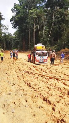 A bus stuck along the trail 