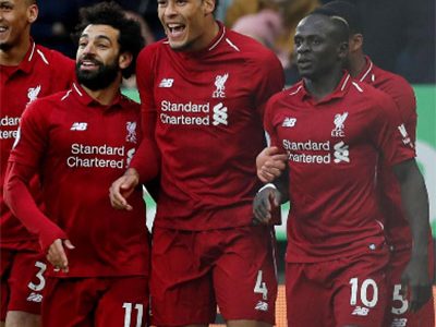Liverpool’s Mohamed Salah (left) celebrates scoring their first goal with Virgil van Dijk (centre) and Sadio Mane (right) in the Newcastle United v Liverpool match in May. (Reuters photo)
