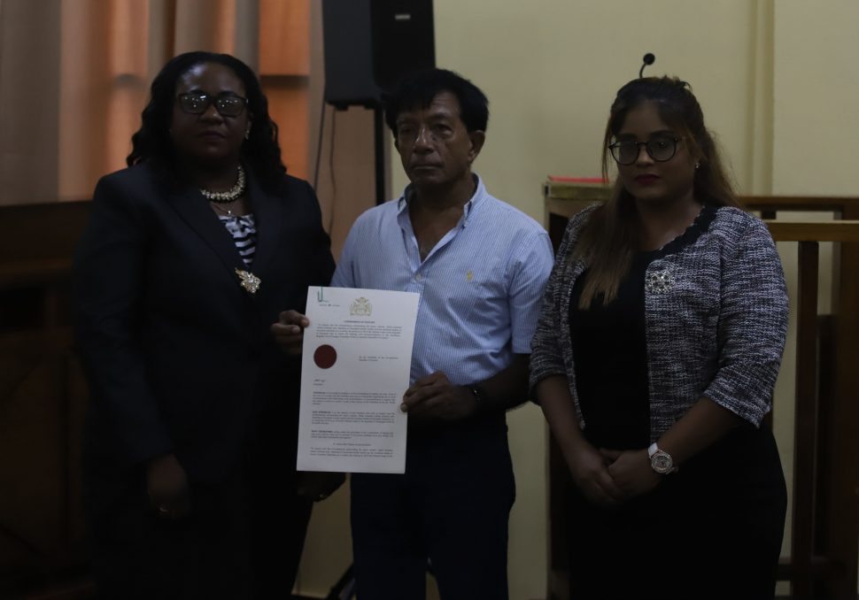Dr. Rishee Thakur (centre) along with Chief Magistrate Ann McLennan (left) and former Magistrate Geeta Chandan-Edmond (right) after Thakur was sworn to lead the Commission of Inquiry into the fatal pirate attack that took place off the coast of Suriname last year. (Terrence Thompson photo)
