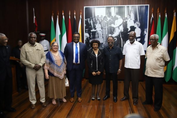 New Chairman of the Guyana Elections Commission, Justice (rtd) Claudette Singh (fourth from right) posed for a photo today with members of the commission. From right are Desmond Trotman, Vincent Alexander, Charles Corbin, Sase Gunraj, Bibi Shadick and Robeson Benn. President David Granger is partly visible at left.