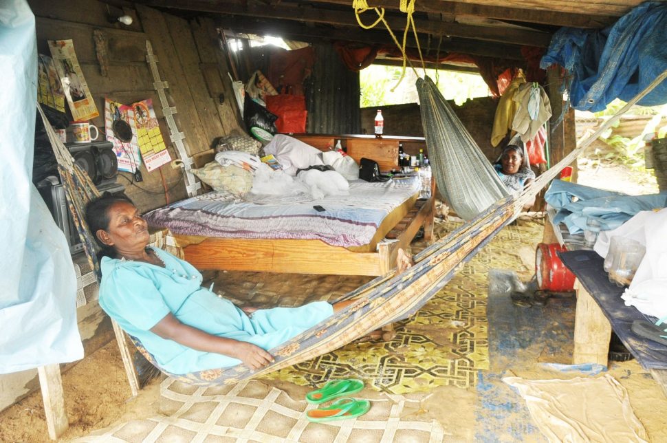 Suganee Sam, left, and her daughter Soomatee relax in hammocks at their home in Rig Road, Barrackpore, on Tuesday.