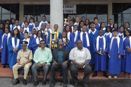 Seated from left are GPF Training Officer Assistant Commissioner, Clifton Hicken; Minister of Public Security, Khemraj Ramjattan; CSSP Programme Coordinator, Clement Henry and an instructor with the graduates. (Department of Public Information photo)
