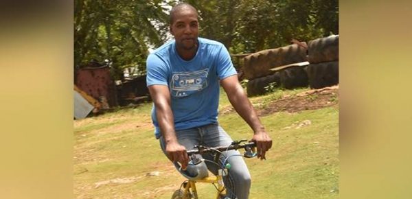 Thirty-sixyear- old David Daley riding his bicycle at his home in Northampton, St Elizabeth. (Photo: Gregory Bennett) 