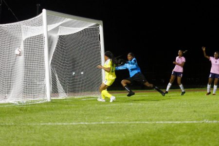 Jenea Knight of Guyana scores her team’s opening goal against Bermuda at the National Track and Field Centre, Leonora in the CONCACAF Women’s U20 Championships on Saturday.
