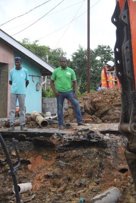 MP for Moruga/Tableland, Dr Lovell Francis (centre) looks on as work begins at Indian Walk, Moruga collapsed road in January.