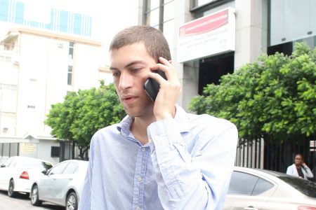 Elias Aboud on his way to the Port-of-Spain Magistrates’ Court to answer charges of marijuana possession and cultivation, yesterday.
