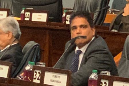MUZZLED: In a series of images, Oropouche East MP Dr Roodal Moonilal sits with a strip of tape which he had placed over his mouth during yesterday’s sitting of the Lower House in Parliament.