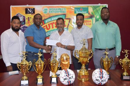 New Era Entertainment Co-Director Aubrey Major Jr [2nd from left] receives the sponsorship cheque from Managing Director of Mohamed’s Enterprise, Nazar Mohamed in the presence of Kenrick Noel [left], Shareef Major [2nd from right] and Ansa McAl representative Jamal Baird [right].
