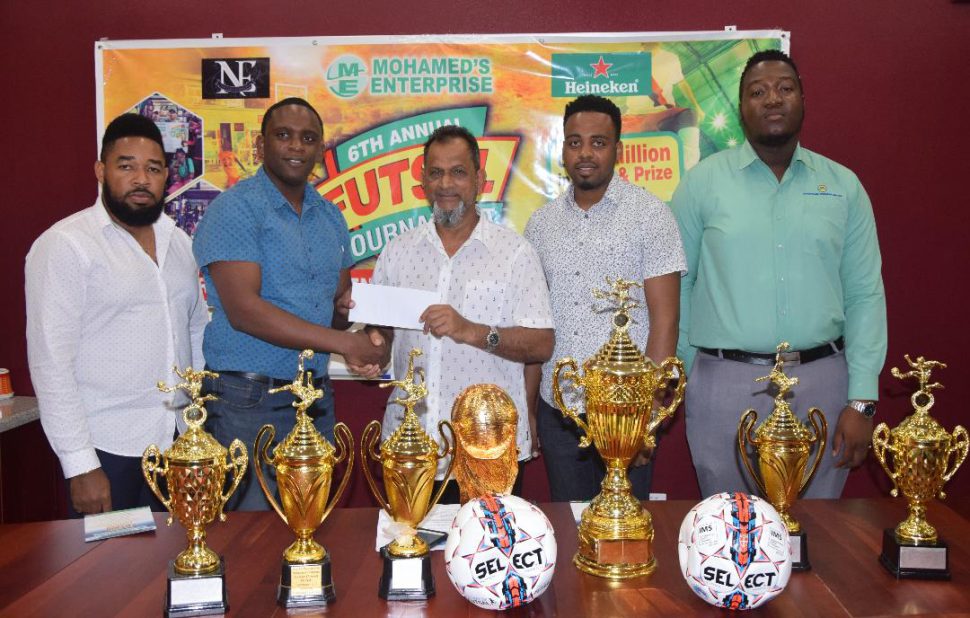 New Era Entertainment Co-Director Aubrey Major Jr [2nd from left] receives the sponsorship cheque from Managing Director of Mohamed’s Enterprise, Nazar Mohamed in the presence of Kenrick Noel [left], Shareef Major [2nd from right] and Ansa McAl representative Jamal Baird [right].
