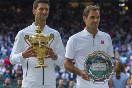 Novak Djokovic and Roger Federer after their epic Wimbledon final yesterday. (Reuter’s photo)
