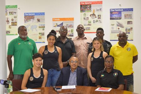 GOA’s President K. Juman Yassin (centre), General Secretary Hector Edwards (standing far left) and Administrative Secretary and Chef-de-Mission for the Pan American Games, Nalini McKoy (sitting far right) along with some of coaches and athletes who will represent Guyana in Peru.