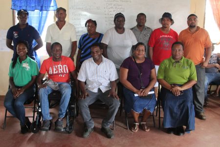 Head of the Co-operative Department Perlina Gifth (seated right) with members of the society 