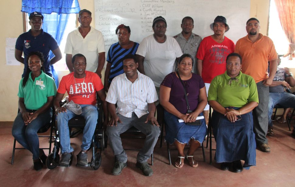 Head of the Co-operative Department Perlina Gifth (seated right) with members of the society 