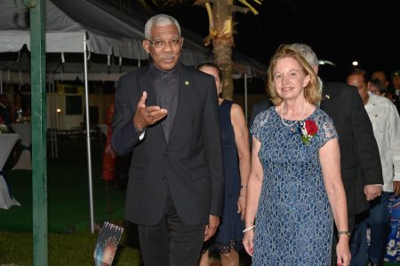 President David Granger in conversation with US Ambassador to Guyana Sarah-Ann Lynch as they make their way to a reception at her residence in celebration of the US’ 243rd anniversary of the Declaration of Independence on Friday.  (Ministry of the Presidency photo)
