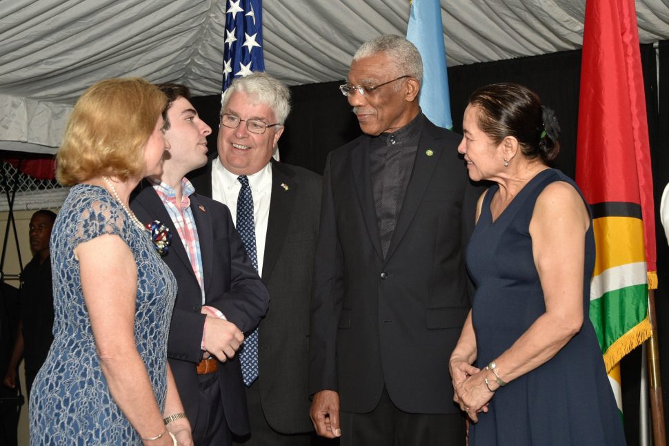President David Granger and First Lady, Sandra Granger shares a light moment with US Ambassador, Sarah Ann Lynch, her husband Kevin and son, Dylan.
