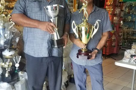 BCB President Hilbert Foster (left) and Ramesh Sunich launched the BCB/Trophy Stall Under-13 Tournament at the Port Mourant Branch.
