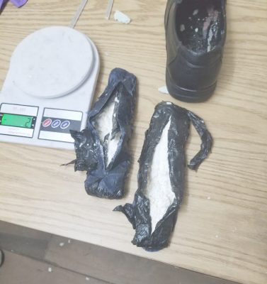 The cocaine that was unearthed in a pair of shoes the man was wearing. 