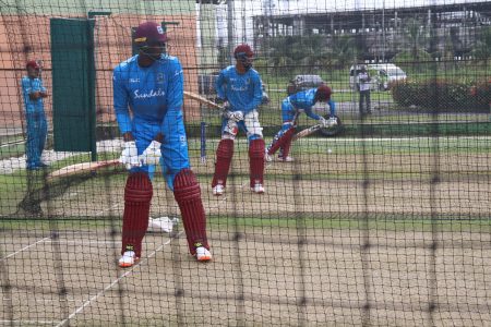 From left to right, Jason Holder, Fabian Allen and Shai Hope have a go in the nets with Jimmy Adams observing at the back. (Romario Samaroo photo)
