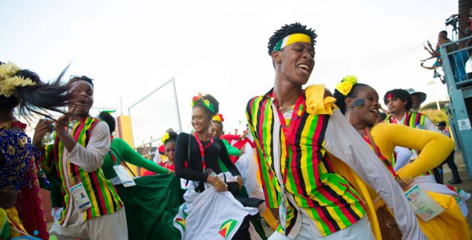 Members of the Guyana delegation during the Parade of Nations for the opening of the fourteenth Caribbean Festival of Arts (CARIFESTA), which began in Trinidad and Tobago yesterday. Guyana’s delegation comprises a hundred members. (Department of Public Information photo) 
