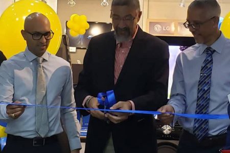 Nicholas Boyer (Left) Clyde De Hass (centre) and Dominic Gaskin cutting the ribbon to officially open the two Courts’ stores.
