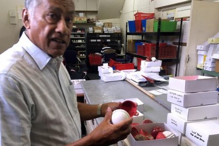 British Cricket Balls Ltd owner Dilip Jajodia holds pieces of the balls in Walthamstow, London, Britain Jul 31, 2019. REUTERS
