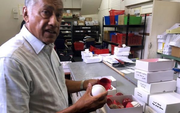 British Cricket Balls Ltd owner Dilip Jajodia holds pieces of the balls in Walthamstow, London, Britain Jul 31, 2019. REUTERS
