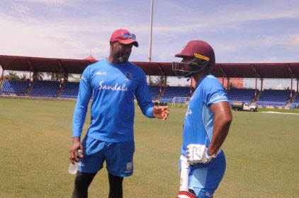 West Indies head coach Floyd Reifer (left) chats with batsman Nicholas Pooran during a training session ahead of the T20 series against India.