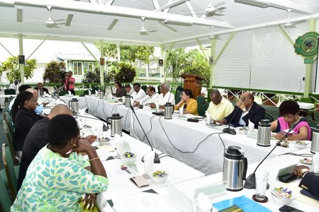 President David Granger (fifth, from right) addresses attendees at the Baridi Benab, State House, in the presence of government ministers, during a meeting on the PSIP in May.  (Ministry of the Presidency photo) 