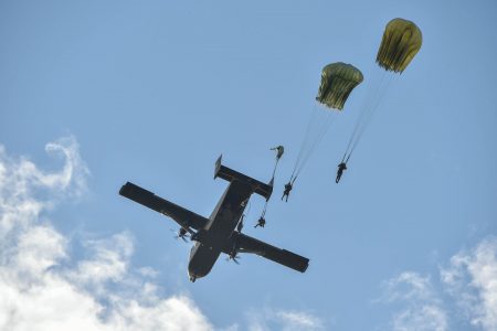 Paratroopers jumping from the GDF’s skyvan during ‘Exercise Greenheart’ on Friday. (Ministry of the Presidency photo)