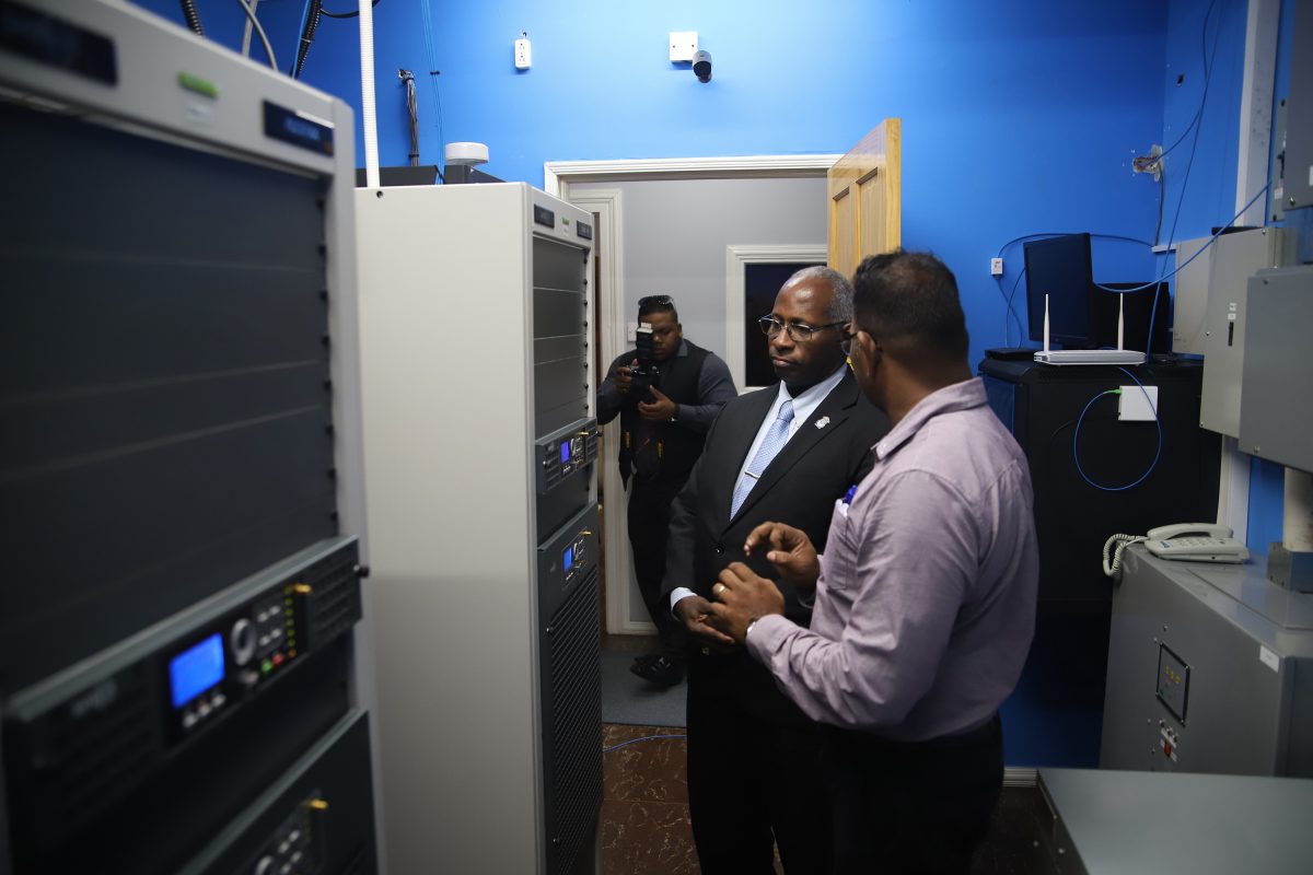 Guyana National Broadcasting Authority Chairman Leslie Sobers inspecting some of the station’s equipment along with Technical Manager Shameer Ali on Friday.
