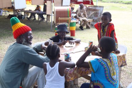 This inter-generational game of Dominoes made for a good time at the National Park on Emancipation Day. (Terrence Thompson photo) 