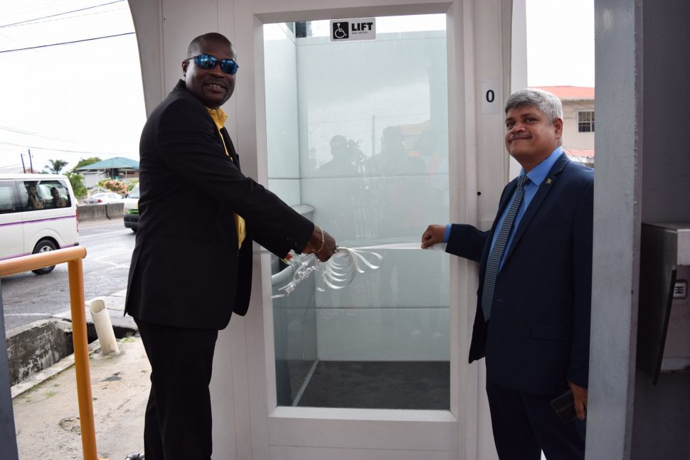 Minister of Public Infrastructure David Patterson and Junior Minister Jaipaul Sharma commission the new lift (Ministry of Public Infrastructure photo)
